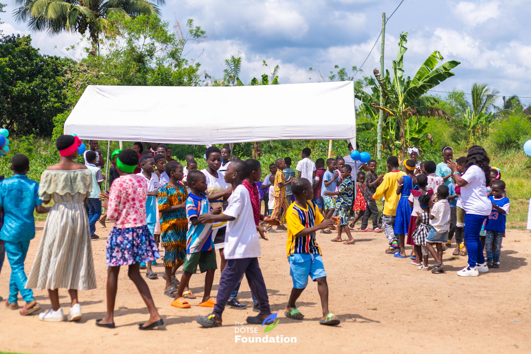 Children playing outdoors during the visit